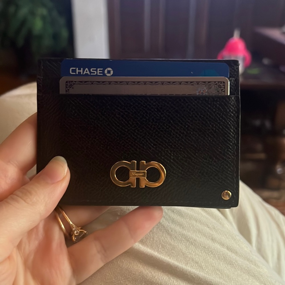 Black leather card case with ID holder in the middle. Great quality.